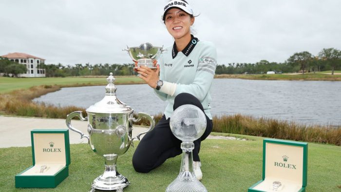 NAPLES, FLORIDA - NOVEMBER 20: Lydia Ko of New Zealand poses for a photo with the Vare Trophy, the Rolex Player of the Year trophy and the CME Globe trophy after winning the CME Group Tour Championship at Tiburon Golf Club on November 20, 2022 in Naples, Florida. (Photo by Michael Reaves/Getty Images)