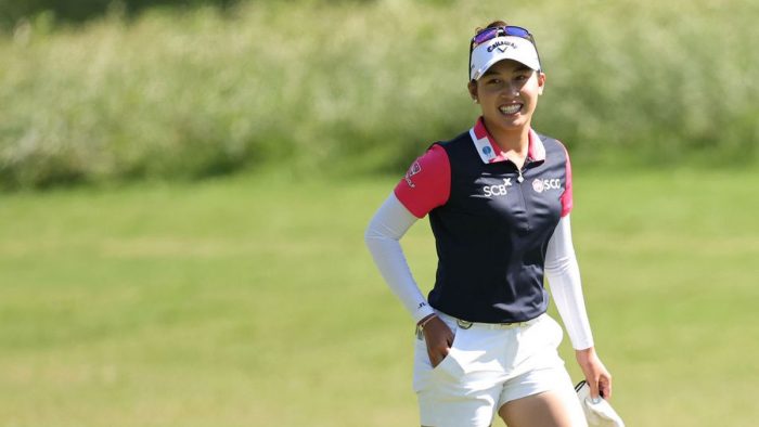 THE WOODLANDS, TEXAS - APRIL 22: Atthaya Thitikul of Thailand smiles before playing her second shot on the first hole during the third round of The Chevron Championship at The Club at Carlton Woods on April 22, 2023 in The Woodlands, Texas. (Photo by Stacy Revere/Getty Images)
