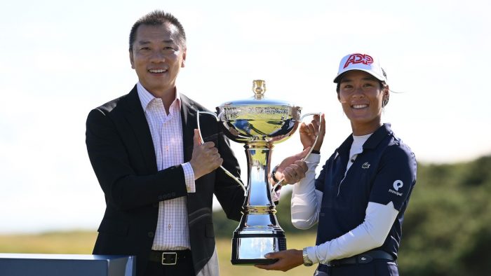 TROON, SCOTLAND - AUGUST 06: CEO Abel Zhao of the FreeD Group presents Celine Boutier of France the championship trophy at the FreeD GROUP Women's Scottish Open presented by Trust Golf at Dundonald Links Golf Course on August 06, 2023 in Troon, Scotland. (Photo by Octavio Passos/Getty Images)