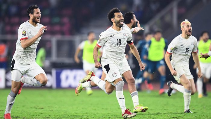 Egypt's forward Mohamed Salah (C) celebrates with teammates after winning the Africa Cup of Nations (CAN) 2021 semi-final football match between Cameroon and Egypt at Stade d'Olembe in Yaounde on February 3, 2022. (Photo by CHARLY TRIBALLEAU / AFP) (Photo by CHARLY TRIBALLEAU/AFP via Getty Images)