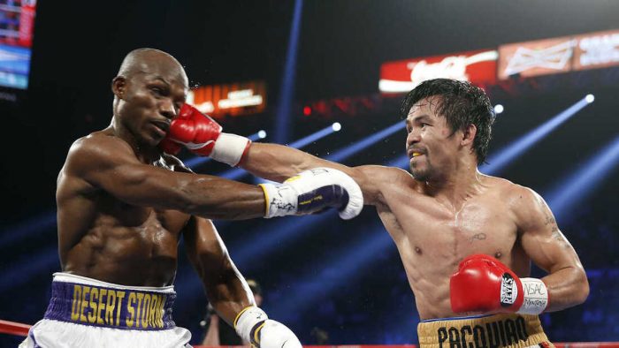 Manny Pacquiao (right), of the Philippines, hits Timothy Bradley Jr. during their WBO welterweight title boxing bout on Saturday in Las Vegas.