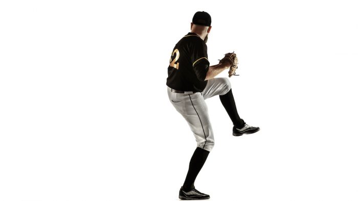 baseball-player-pitcher-black-uniform-practicing-training-isolated-white-background