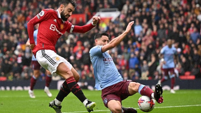 Manchester United's Portuguese midfielder Bruno Fernandes (L) shoots and scores his team first goal during the English Premier League football match between Manchester United and Aston Villa at Old Trafford in Manchester, north west England, on April 30, 2023. (Photo by Oli SCARFF / AFP) / RESTRICTED TO EDITORIAL USE. No use with unauthorized audio, video, data, fixture lists, club/league logos or 'live' services. Online in-match use limited to 120 images. An additional 40 images may be used in extra time. No video emulation. Social media in-match use limited to 120 images. An additional 40 images may be used in extra time. No use in betting publications, games or single club/league/player publications. /  (Photo by OLI SCARFF/AFP via Getty Images)