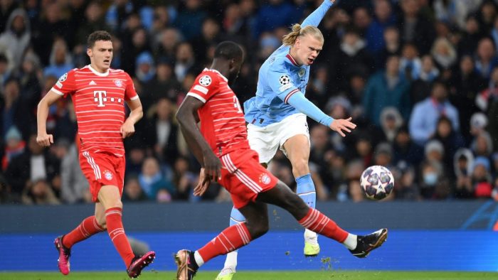 MANCHESTER, ENGLAND - APRIL 11: Erling Haaland of Manchester City shoots whilst under pressure from Dayot Upamecano of FC Bayern Munich during the UEFA Champions League quarterfinal first leg match between Manchester City and FC Bayern München at Etihad Stadium on April 11, 2023 in Manchester, England. (Photo by Shaun Botterill/Getty Images)