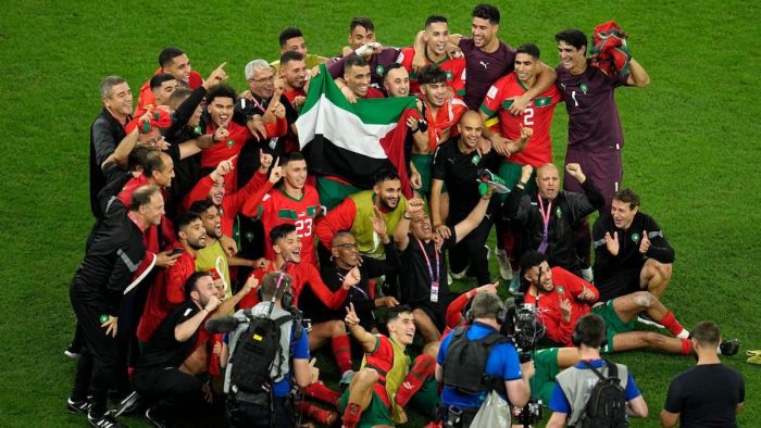 morocco-players-palestinian-flag-world-cup-win-spain-doha-dec-2022-associated-press-min