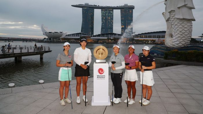 SINGAPORE, SINGAPORE - MARCH 07: (L-R) Vanessa Richani of Lebanon, Minsol Kim of South Korea, Ting-Hsuan Huang of Chinese Taipei, Aloysa Margiela Atienza of Singapore and Yuna Araki of Japan pose with the Women's Amateur Asia-Pacific Championship trophy with the Marina Bay Sands Hotel and Merlion in the background prior to The Women's Amateur Asia-Pacific Championship on The New Course at The Singapore Island Country Club on March 07, 2023 in Singapore, Singapore. (Photo by Andrew Redington/R&A/R&A via Getty Images)