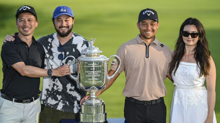 LOUISVILLE, KENTUCKY - MAY 19:  Xander Schauffele and his family members, from left, uncle Gao-Ya Chen, brother Nico Schauffele and wife Maya Schauffele smile with the Wanamaker Trophy after his one stroke victory in the final round of the 106th PGA Championship at Valhalla Golf Club on May 19, 2024 in Louisville, Kentucky. (Photo by Keyur Khamar/PGA TOUR via Getty Images)
